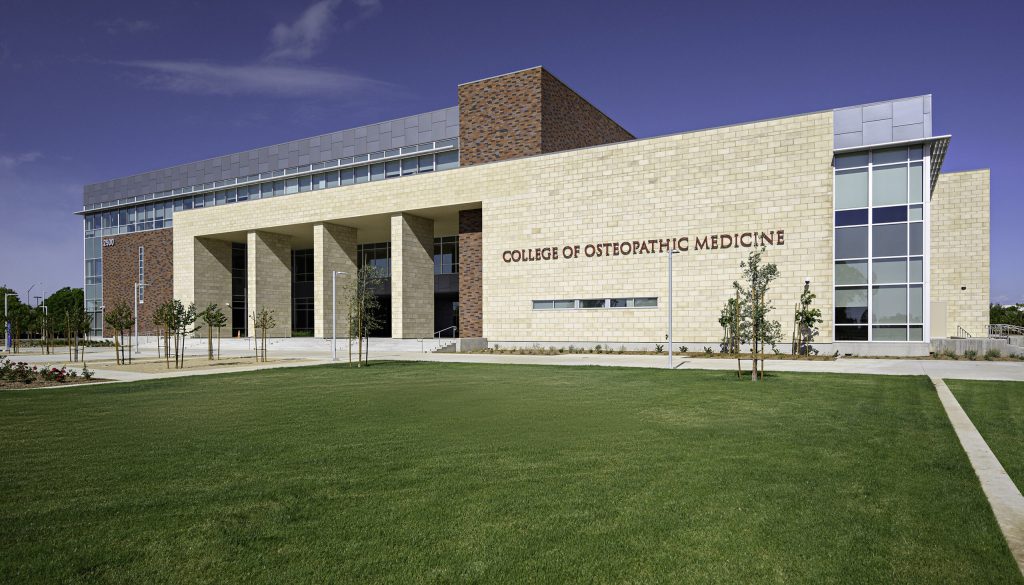 building with green grass