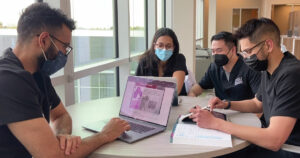 students studying with laptops