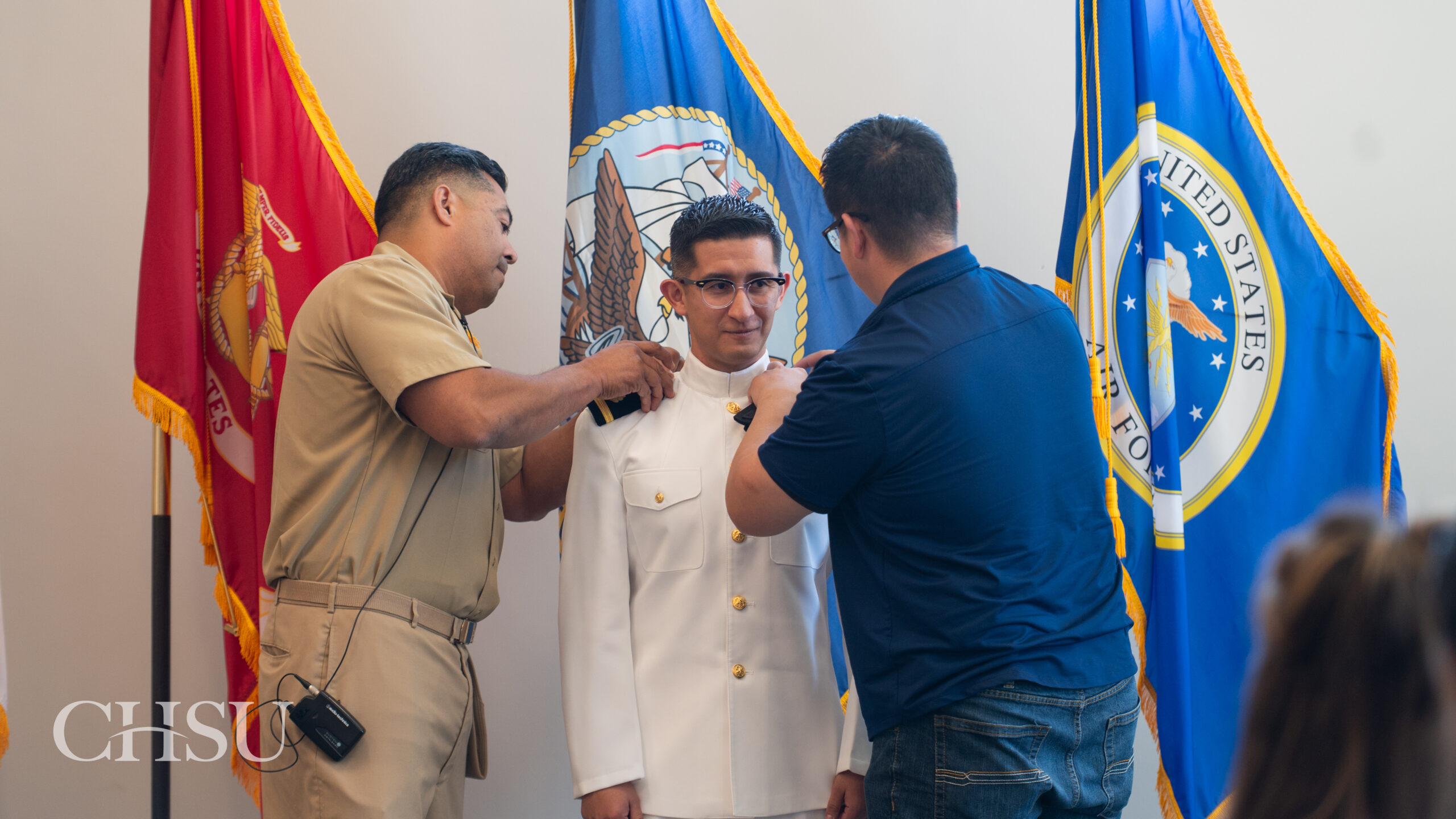 military officer medical graduate having uniform pinned with new rank