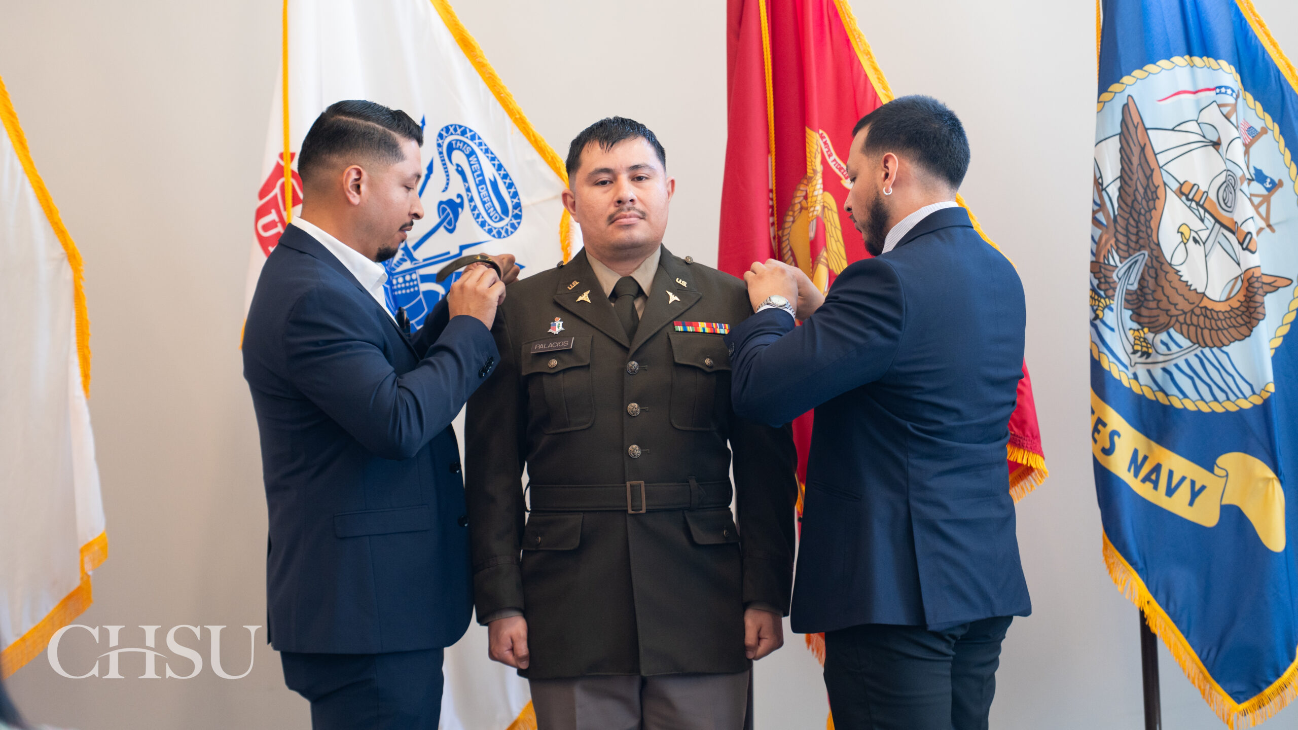 military officer medical graduate having uniform pinned with new rank