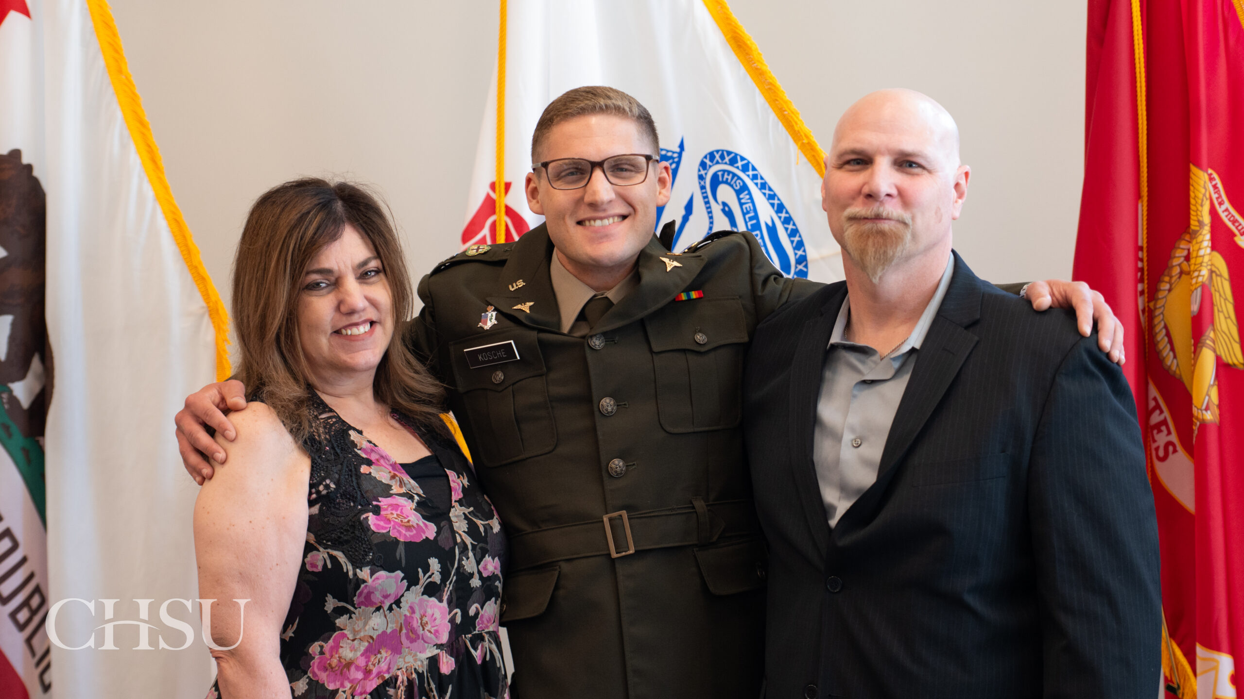 military officer medical graduate in uniform with family
