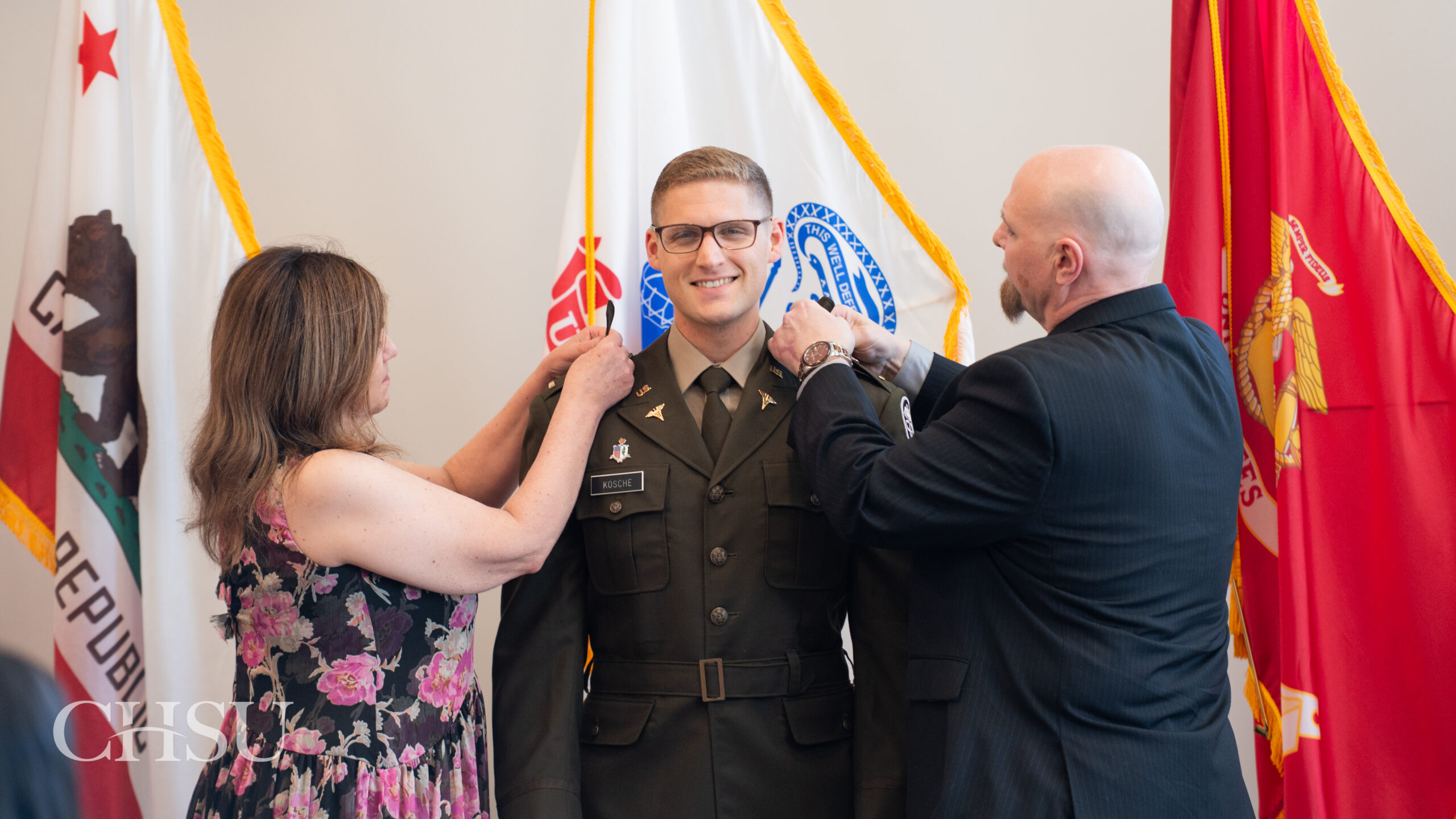 military officer medical graduate having uniform pinned with new rank