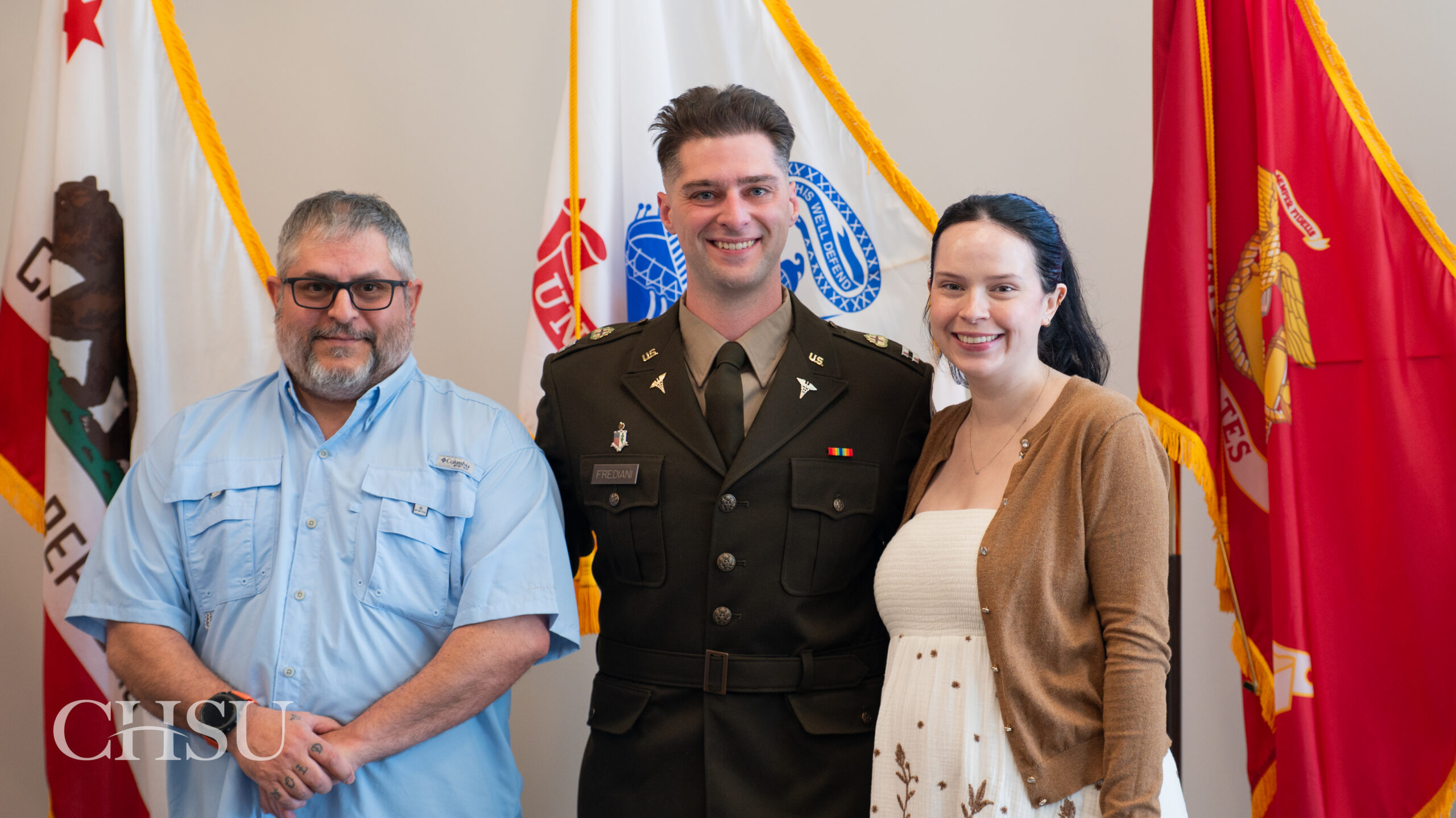 military officer medical graduate in uniform with family