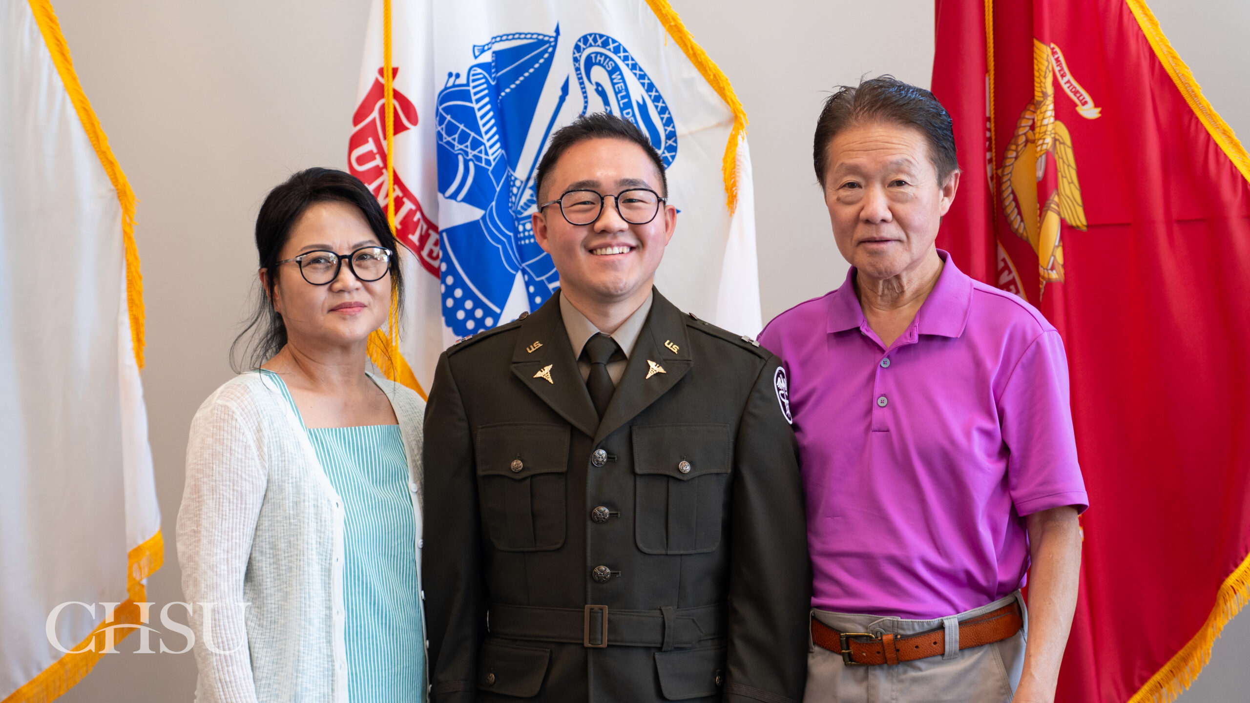 military officer medical graduate in uniform with family