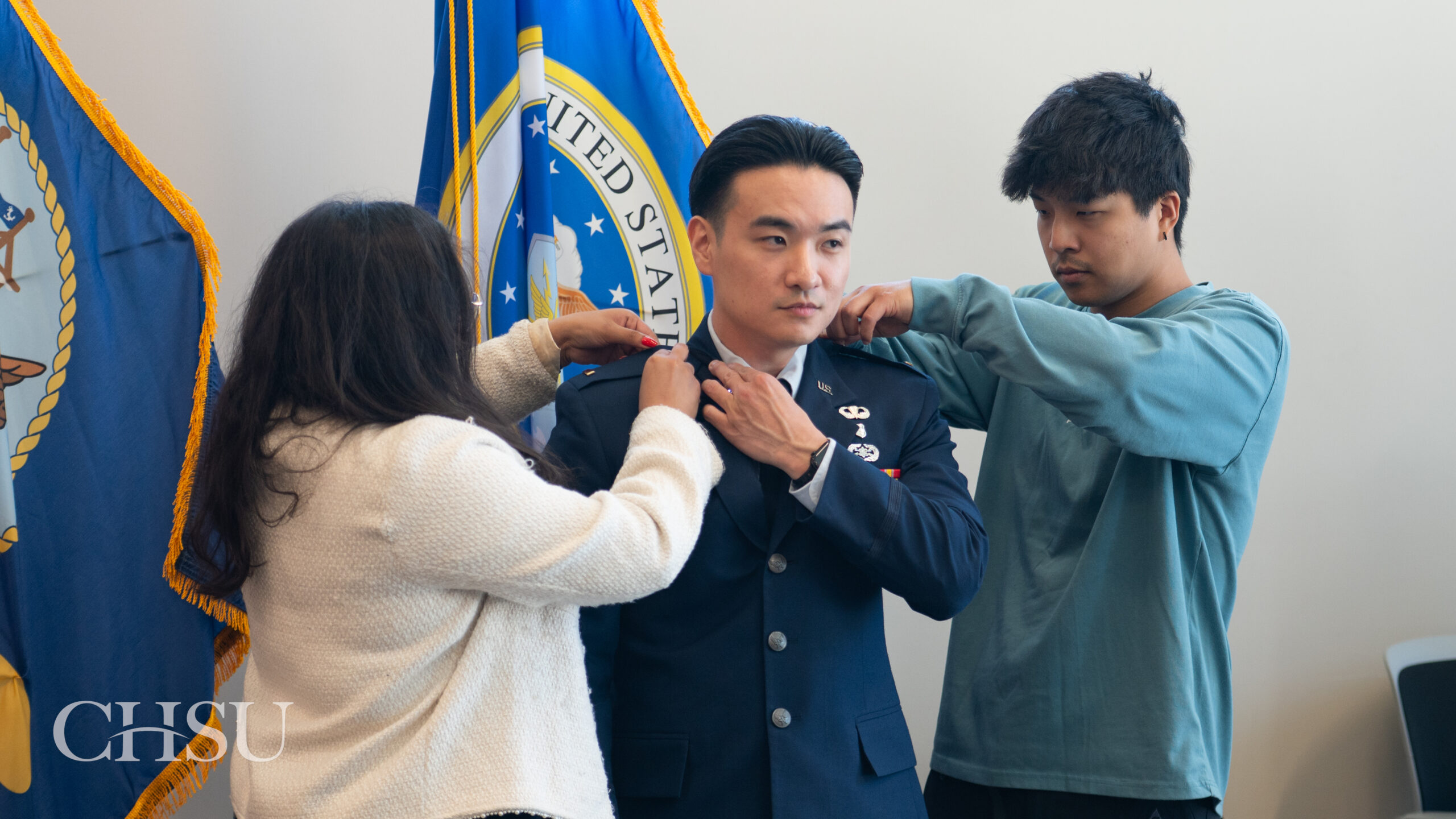 military officer medical graduate having uniform pinned with new rank