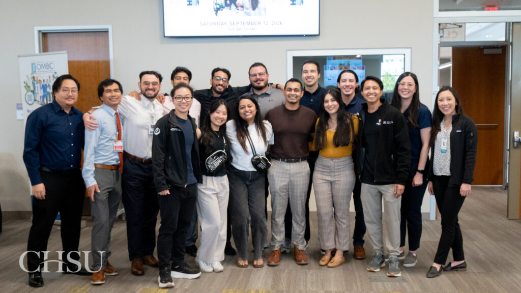 CHSU alumni pose for a group photo after returning to represent their residency programs at the 2026 CHSU-COM Residency Fair.