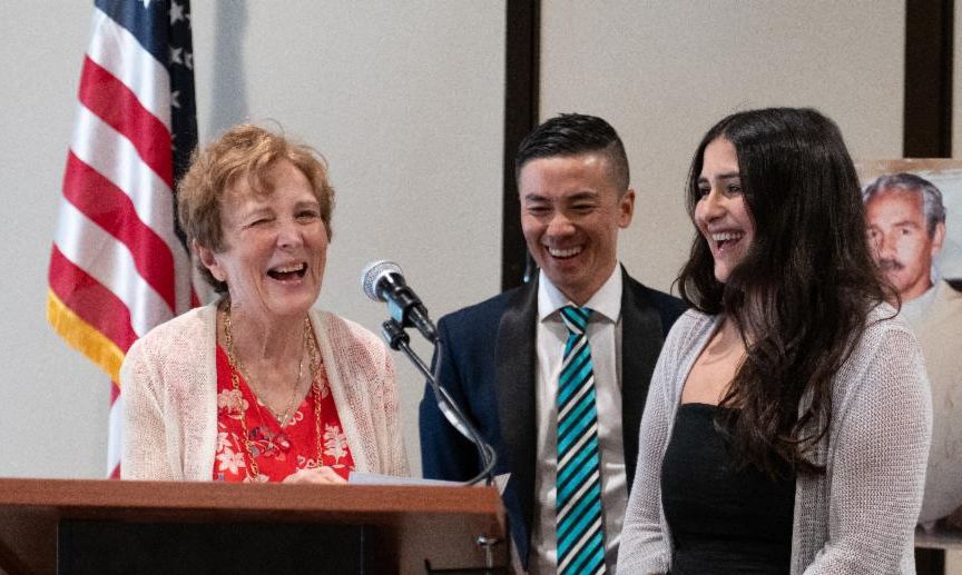 Dr. Pamela Kammen, Dr. Duc Chung, and Dr. Marissa Monazzami at podium