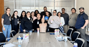 people with manikin in group photo