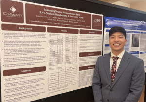 person standing in front of research poster