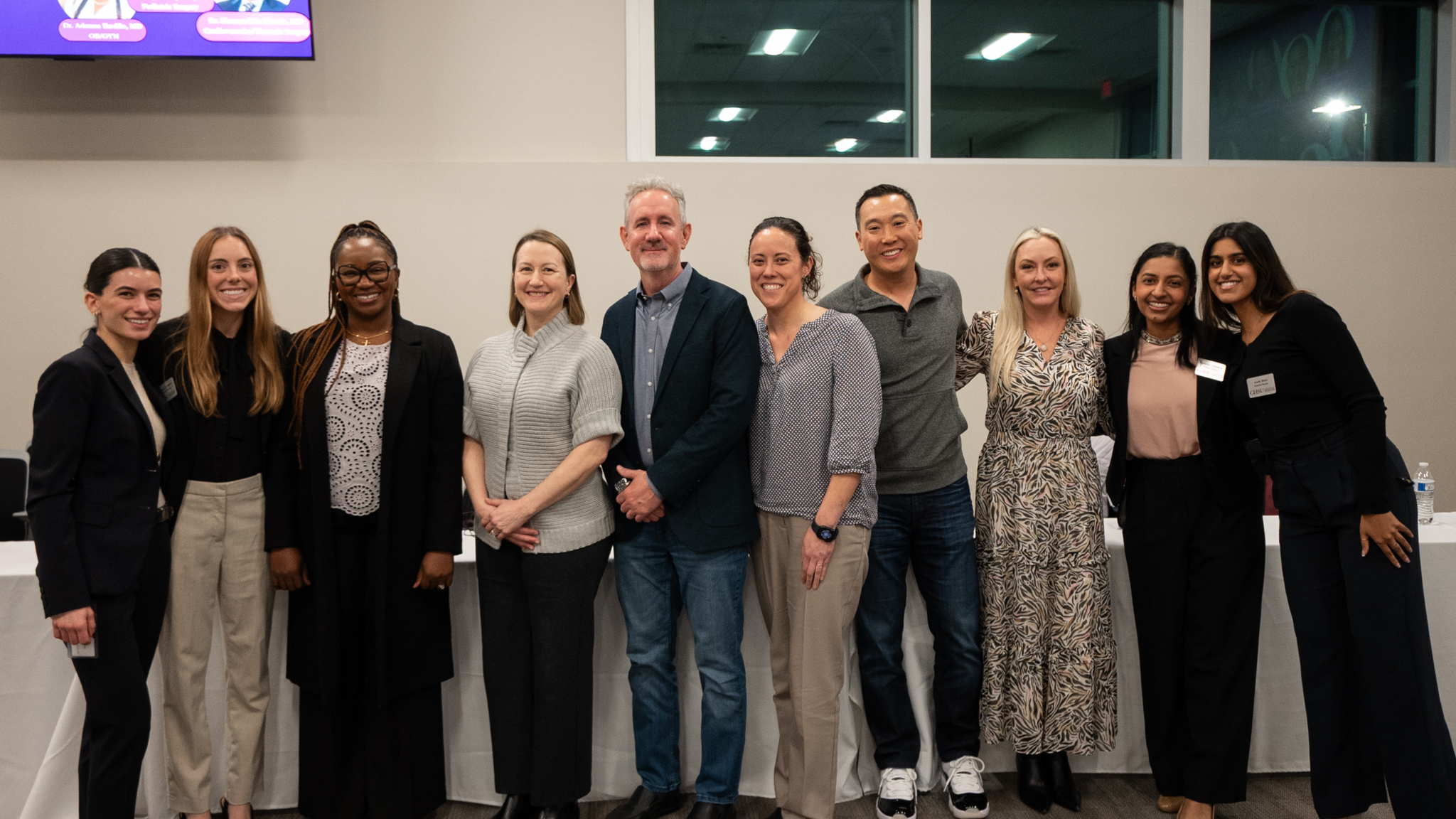 group photo of surgeons and medical students in classroom at AWS Surgeon Panel