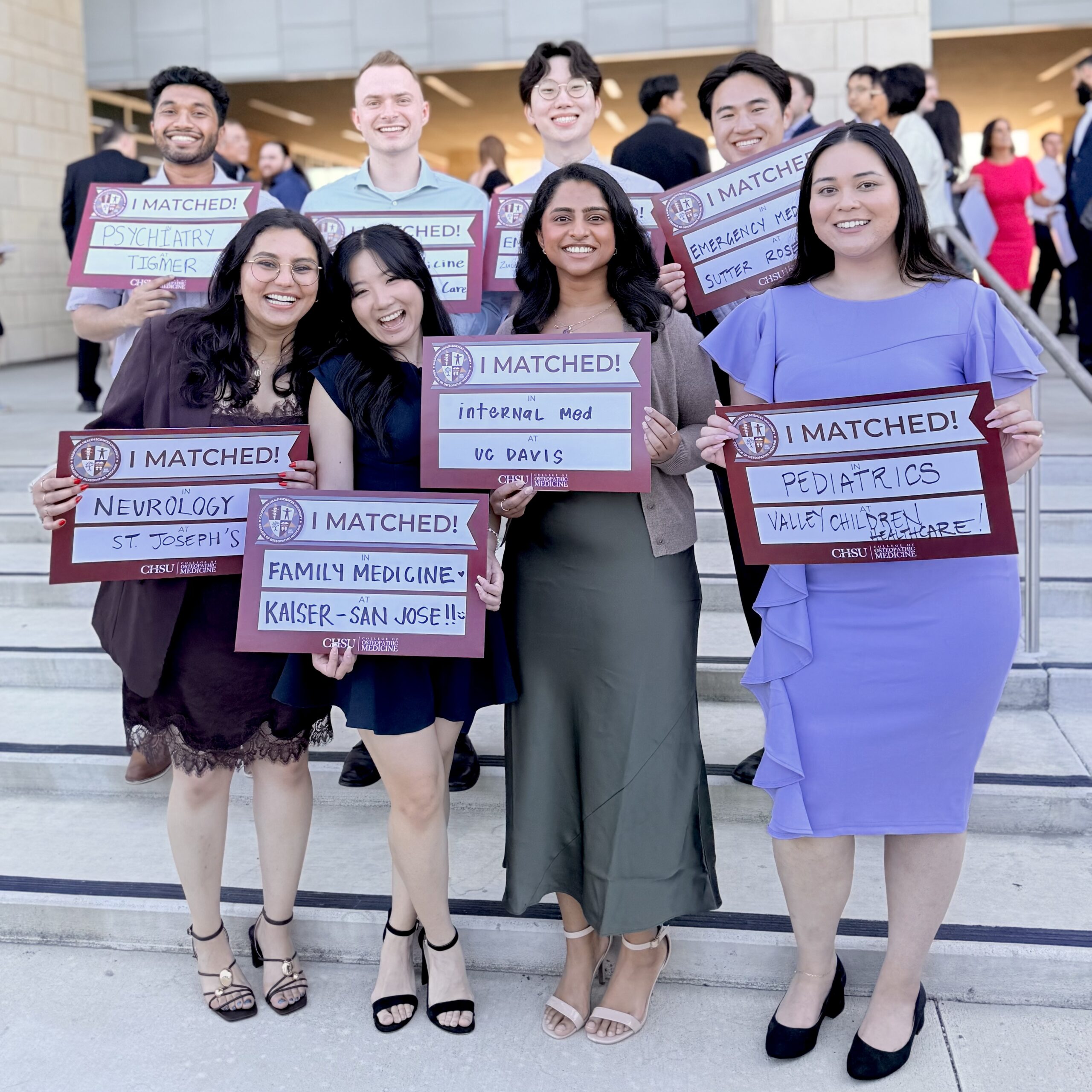 students holding CHSU-COM I Matched signs for residency placement