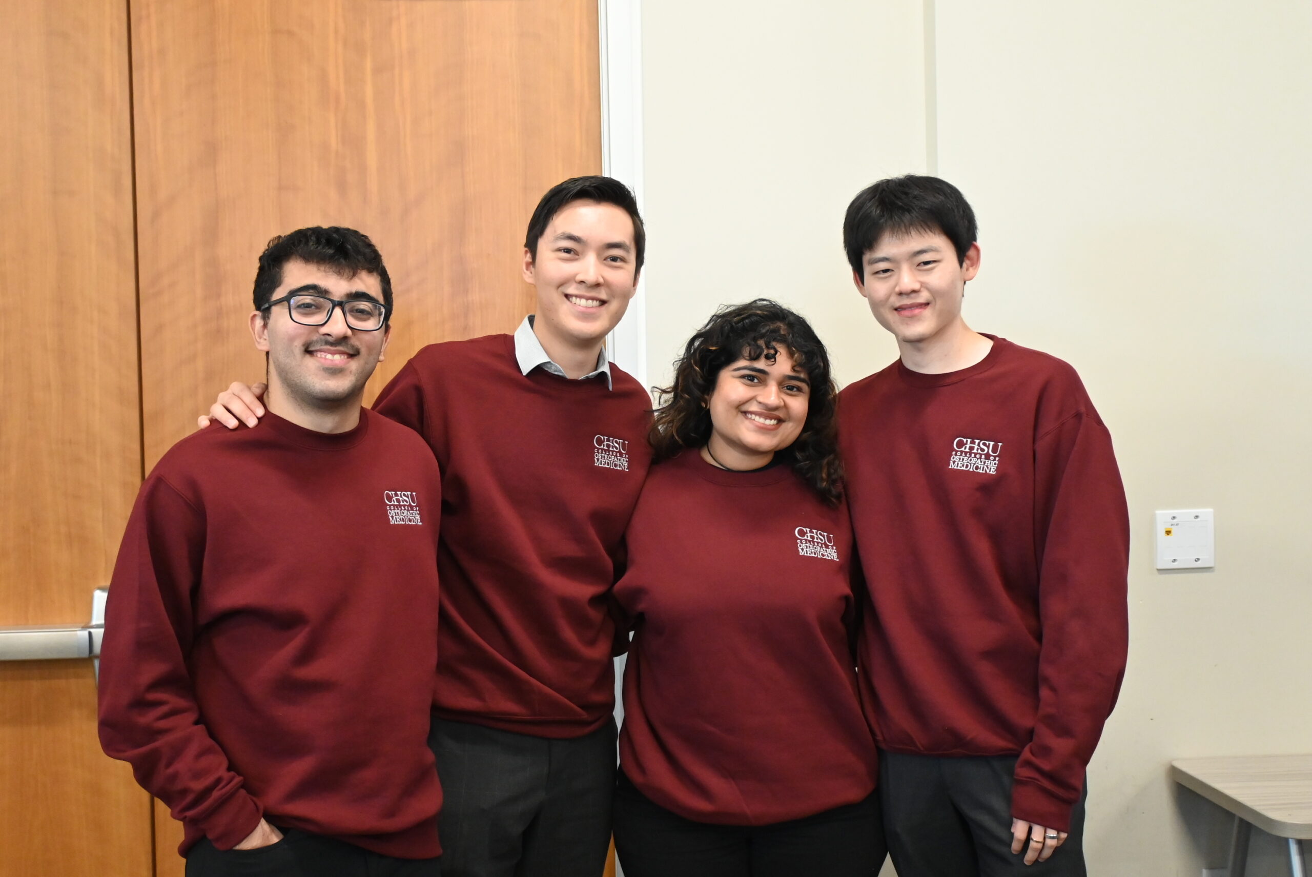 Four Students wearing CHSU sweaters