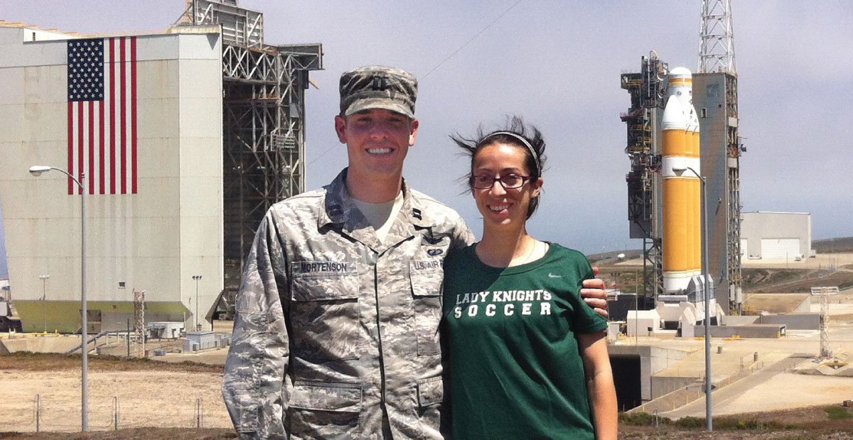 man in uniform standing outside satellite launch