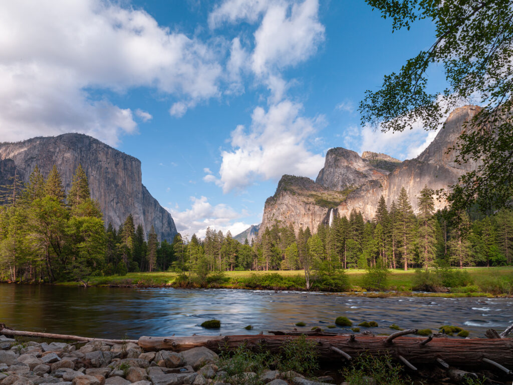 lake with mountains and blue sky with clouds