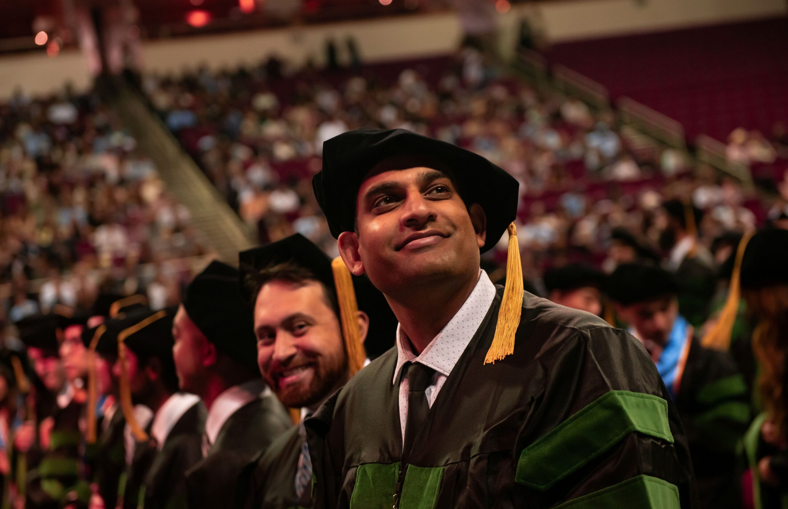graduates seated wearing regalia at Commencement