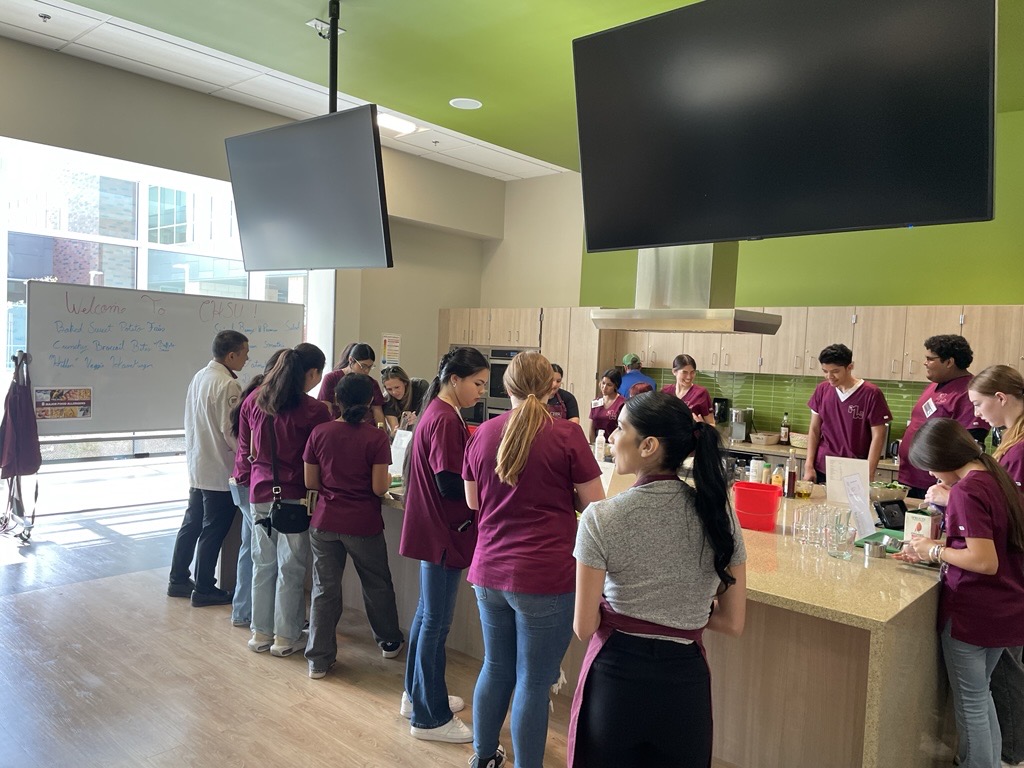 high school students in CHSU teaching kitchen for demonstration