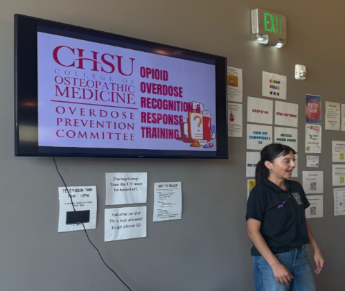 A CHSU medical student leads an opioid overdose recognition and response training at a behavioral health center.