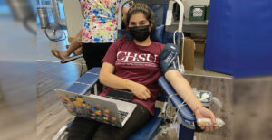 Female student donating blood