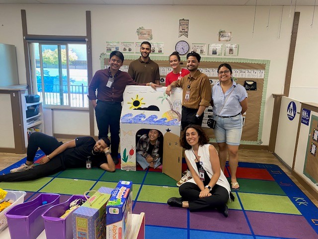 Students with playhouse