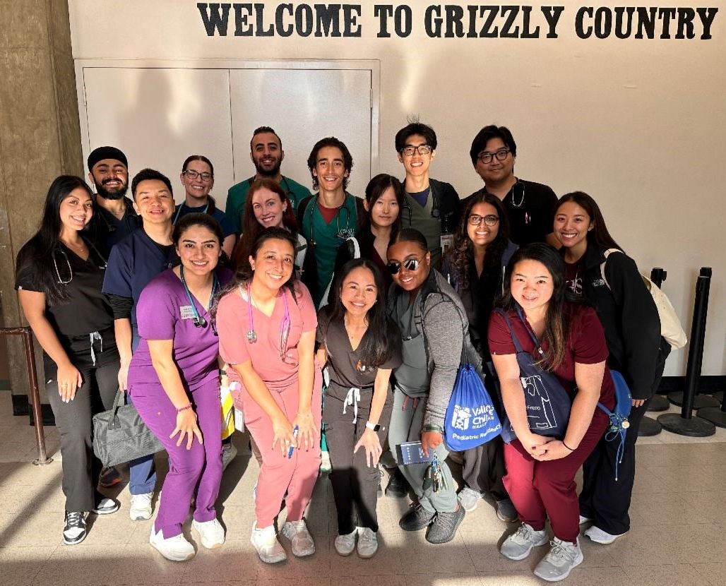 People in group under Welcome to Grizzly Country sign