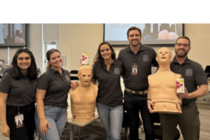 students with manikins for naloxone training for overdose prevention